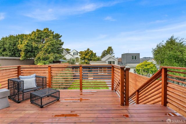 a view of a balcony with chairs