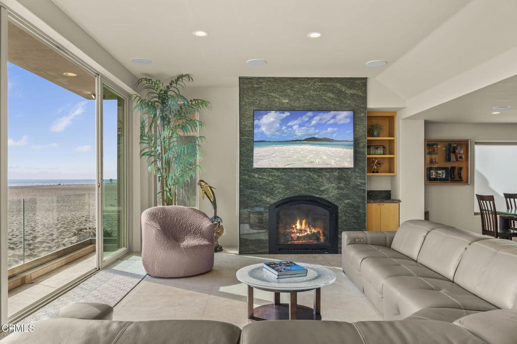 3629 Ocean Drive Oxnard, CA 93035 - Photo 11 of 60 a living room with furniture and a fireplace