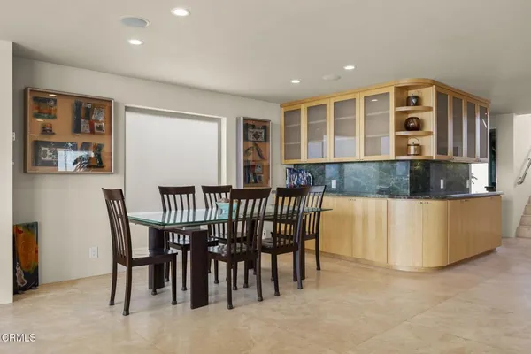 a view of a dining room with furniture window and outside view