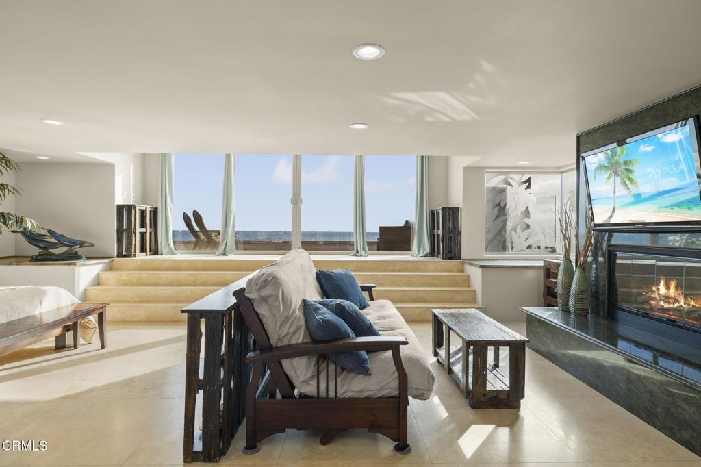 3629 Ocean Drive Oxnard, CA 93035 - Photo 27 of 60 a view of a dining room with furniture and a fireplace