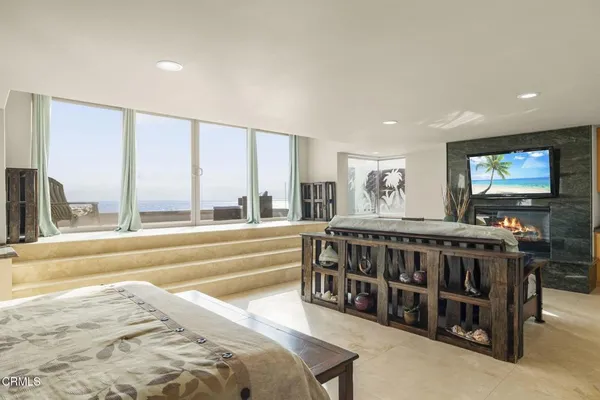 a view of living room with furniture and large window
