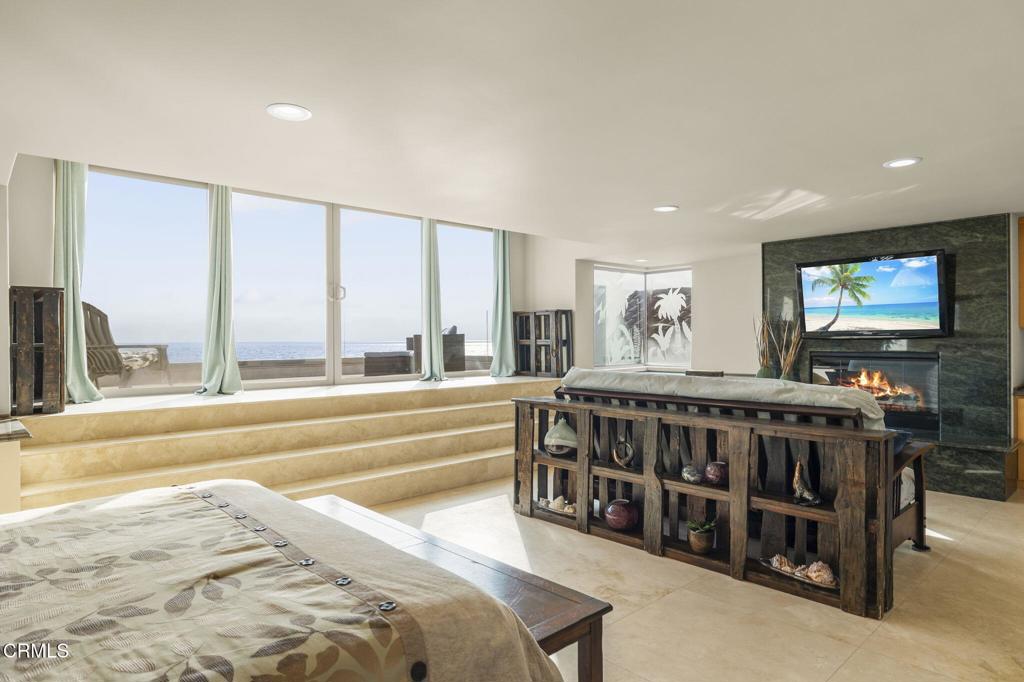 3629 Ocean Drive Oxnard, CA 93035 - Photo 30 of 60 a living room with furniture a large window and a flat screen tv
