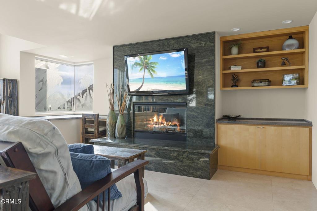3629 Ocean Drive Oxnard, CA 93035 - Photo 32 of 60 a living room with furniture and a fireplace
