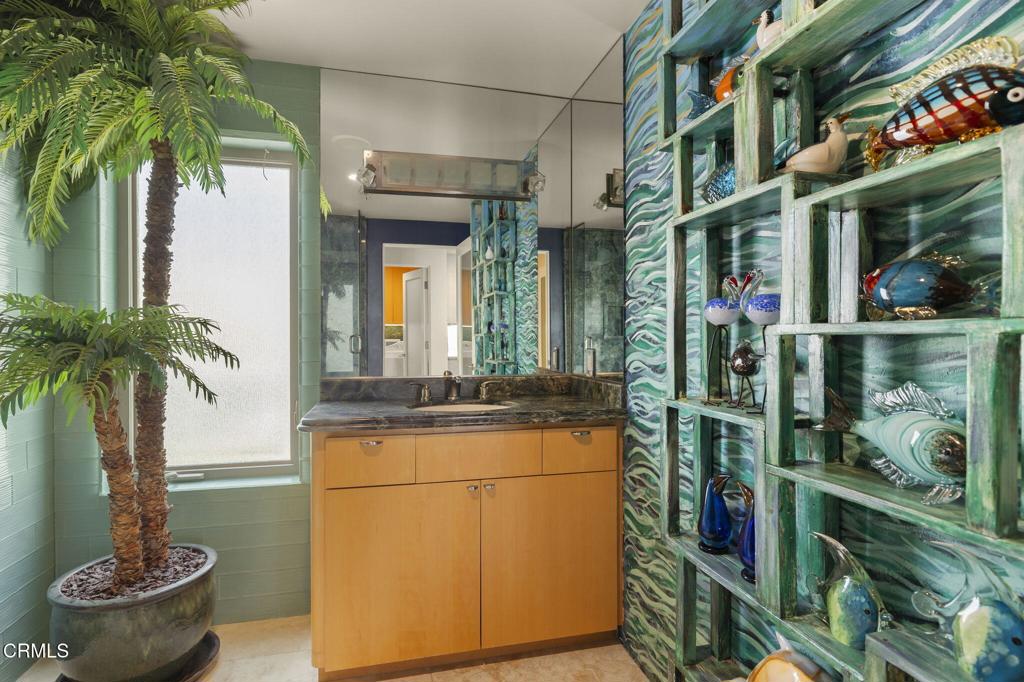 3629 Ocean Drive Oxnard, CA 93035 - Photo 49 of 60 a vase of flowers sitting on a table in front of a house