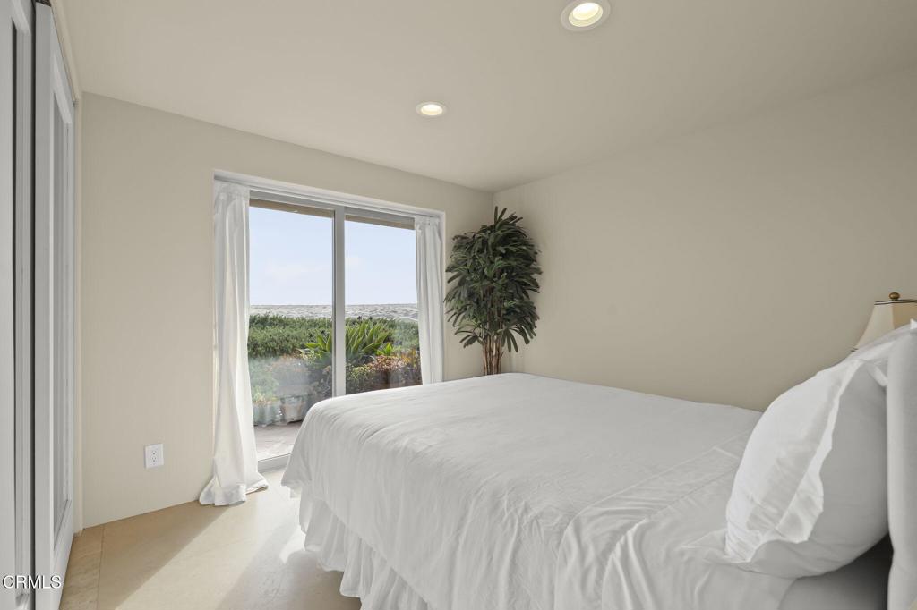 3629 Ocean Drive Oxnard, CA 93035 - Photo 54 of 60 a bedroom with a bed and a large window
