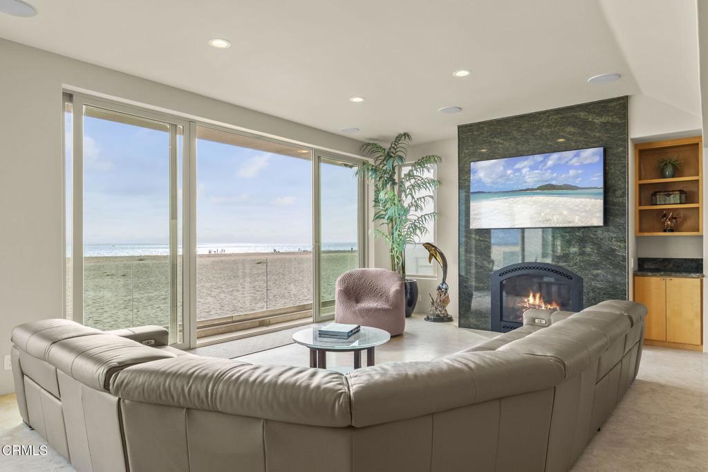 3629 Ocean Drive Oxnard, CA 93035 - Photo 10 of 60 a living room with furniture and a fireplace