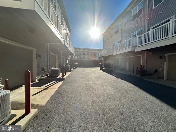 a view of a street with a building in the background