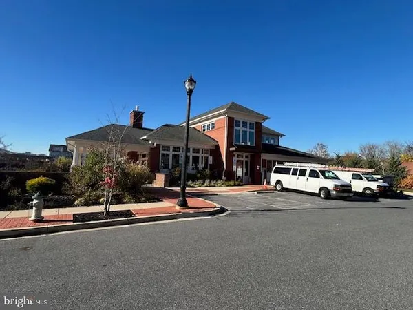 a front view of a residential apartment building with a yard
