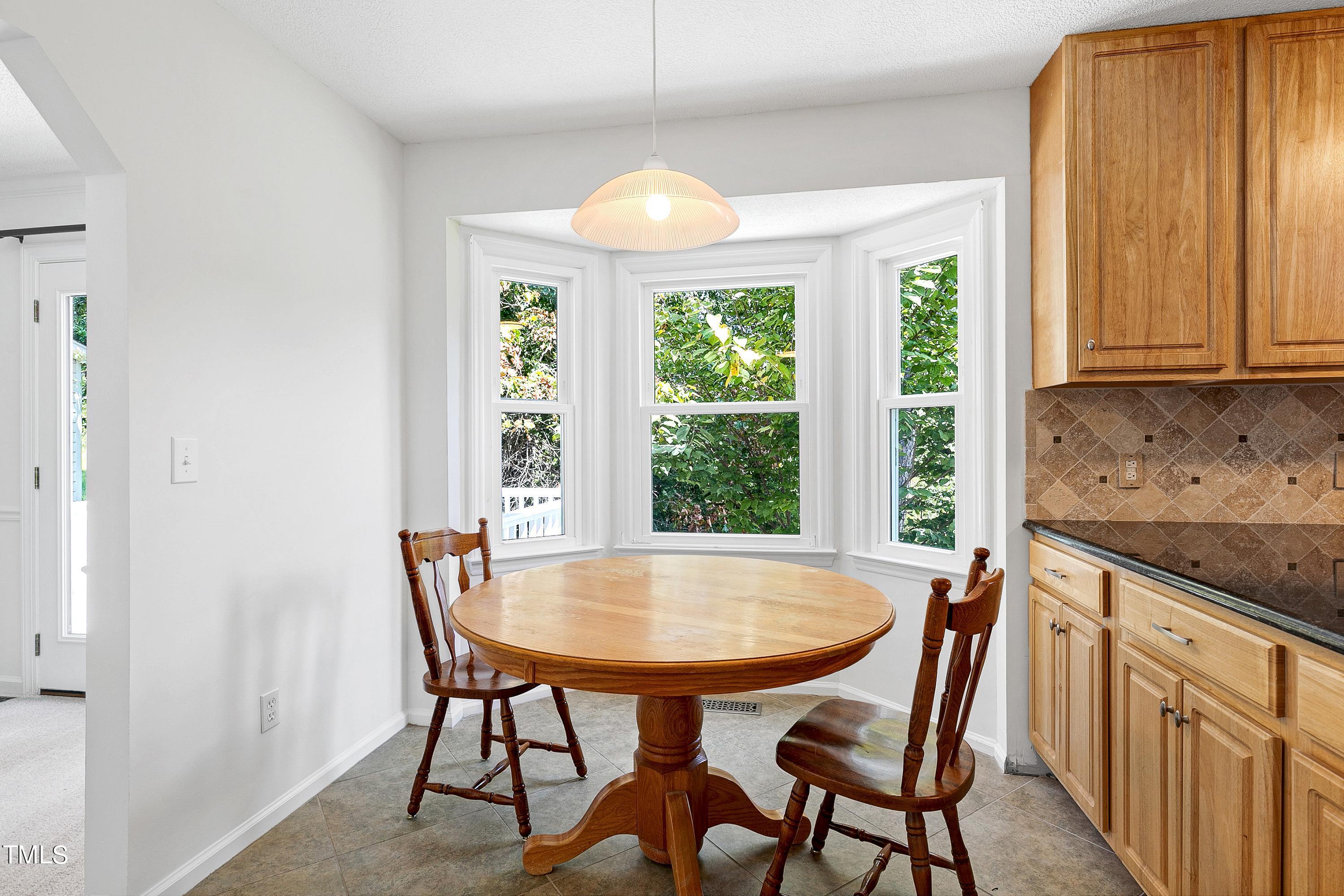 3900 Old Coach Road Raleigh, NC 27616 - Photo 5 of 23 Sunny breakfast nook with tile floor and bay window...