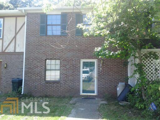 5768 Old Gordon Road Mableton, GA 30126 - Photo 1 of 1 a view of a brick house with a yard