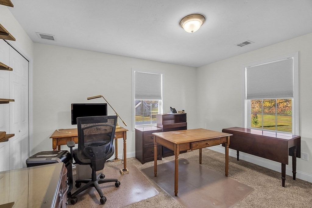 79 River Road Pepperell, MA 01463 - Photo 11 of 30 a view of a workspace with furniture and a window