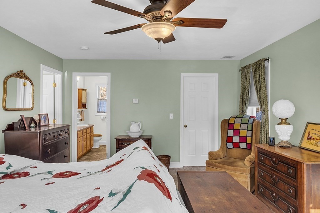 79 River Road Pepperell, MA 01463 - Photo 13 of 30 a bedroom with a bed and wooden floor