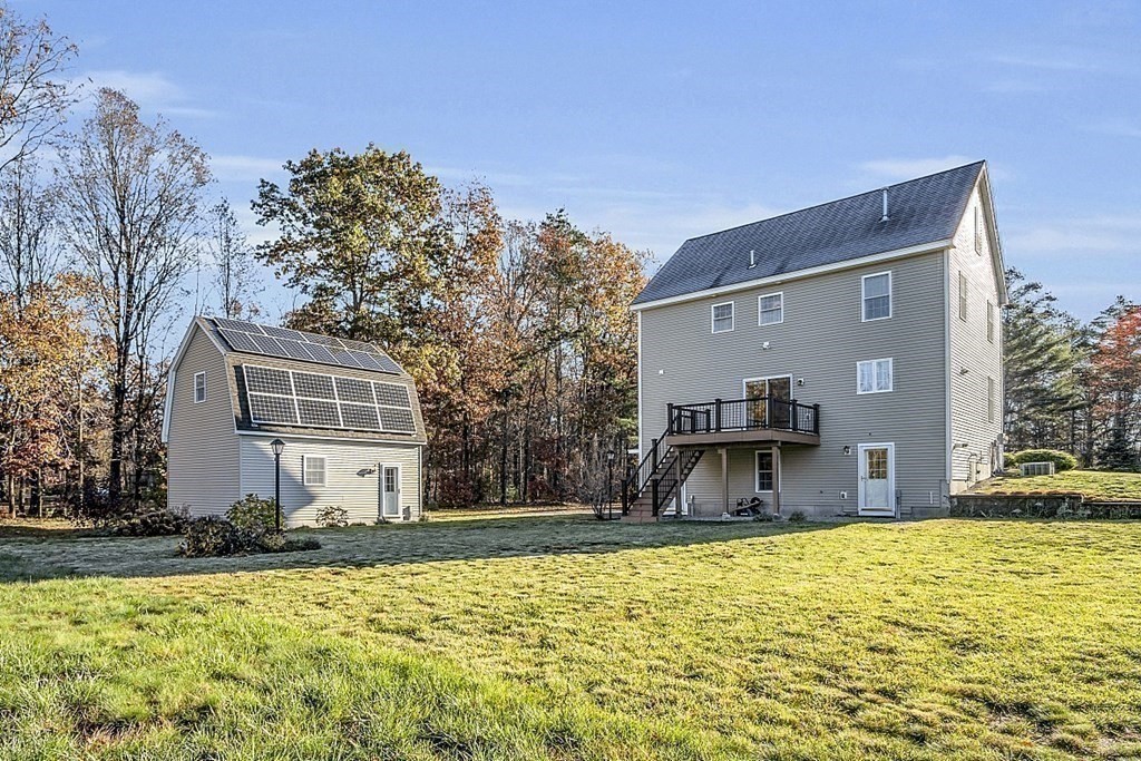 79 River Road Pepperell, MA 01463 - Photo 19 of 30 a front view of a house with a yard