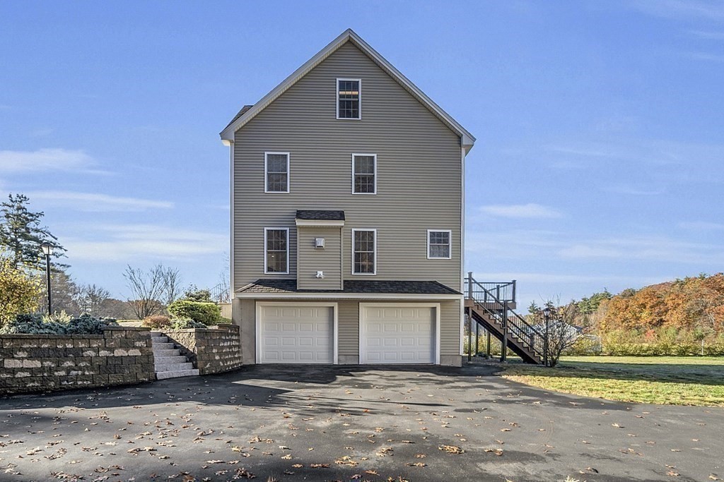 79 River Road Pepperell, MA 01463 - Photo 20 of 30 a view of a house with a yard