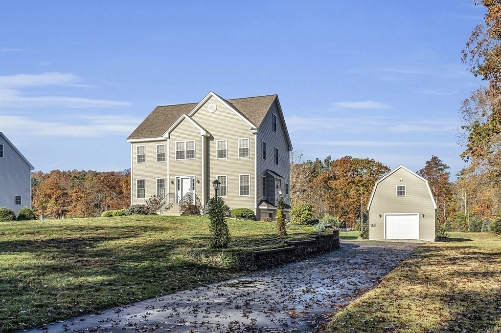 79 River Road Pepperell, MA 01463 - Photo 2 of 30 a view of a house with a yard