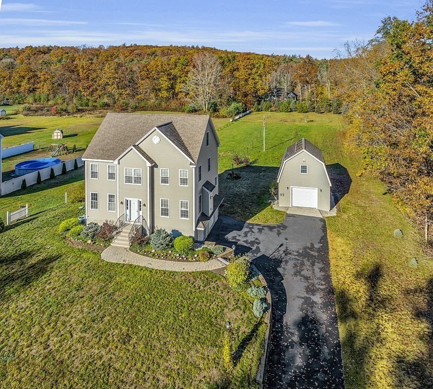 79 River Road Pepperell, MA 01463 - Photo 29 of 30 a aerial view of a house with a garden