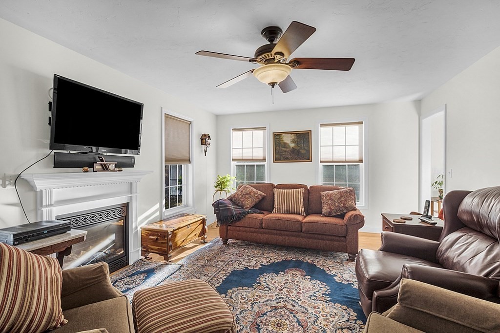 79 River Road Pepperell, MA 01463 - Photo 4 of 30 a living room with furniture and a flat screen tv