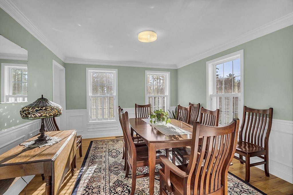 79 River Road Pepperell, MA 01463 - Photo 6 of 30 a view of a dining room with furniture and wooden floor
