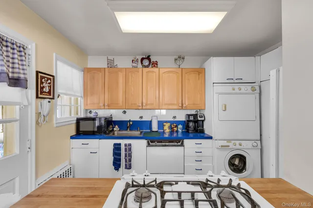 a view of kitchen with stainless steel appliances kitchen island a refrigerator sink and cabinets