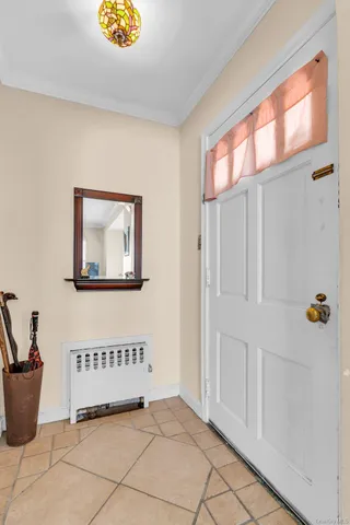 a view of entryway with a chandelier