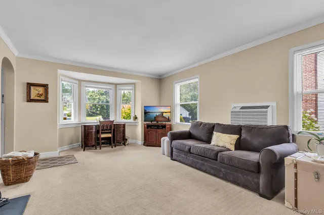 a living room with furniture and a window