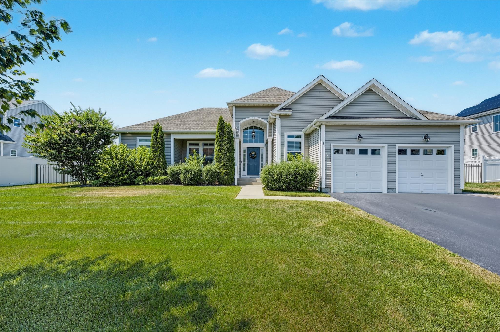 4 Lilac Lane Ridge, NY 11961 - Photo 1 of 1 View of front of house featuring an attached garage and driveway