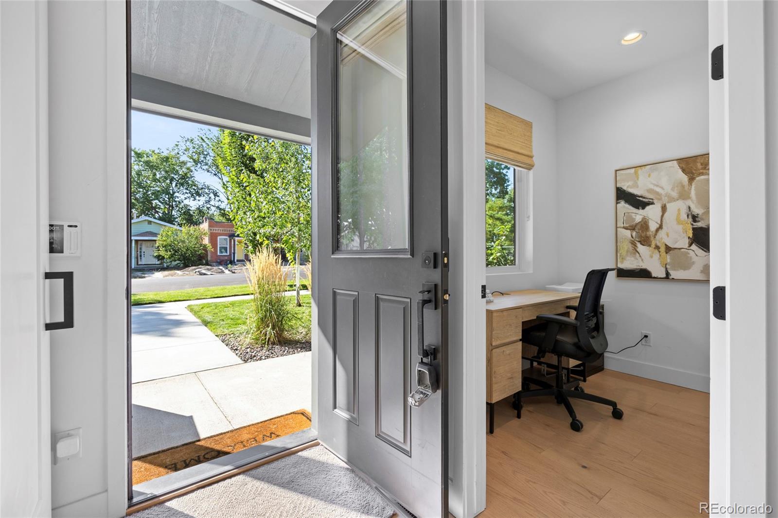 3922 Osage Street Denver, CO 80211 - Photo 14 of 44 a view of a livingroom with workspace and a window