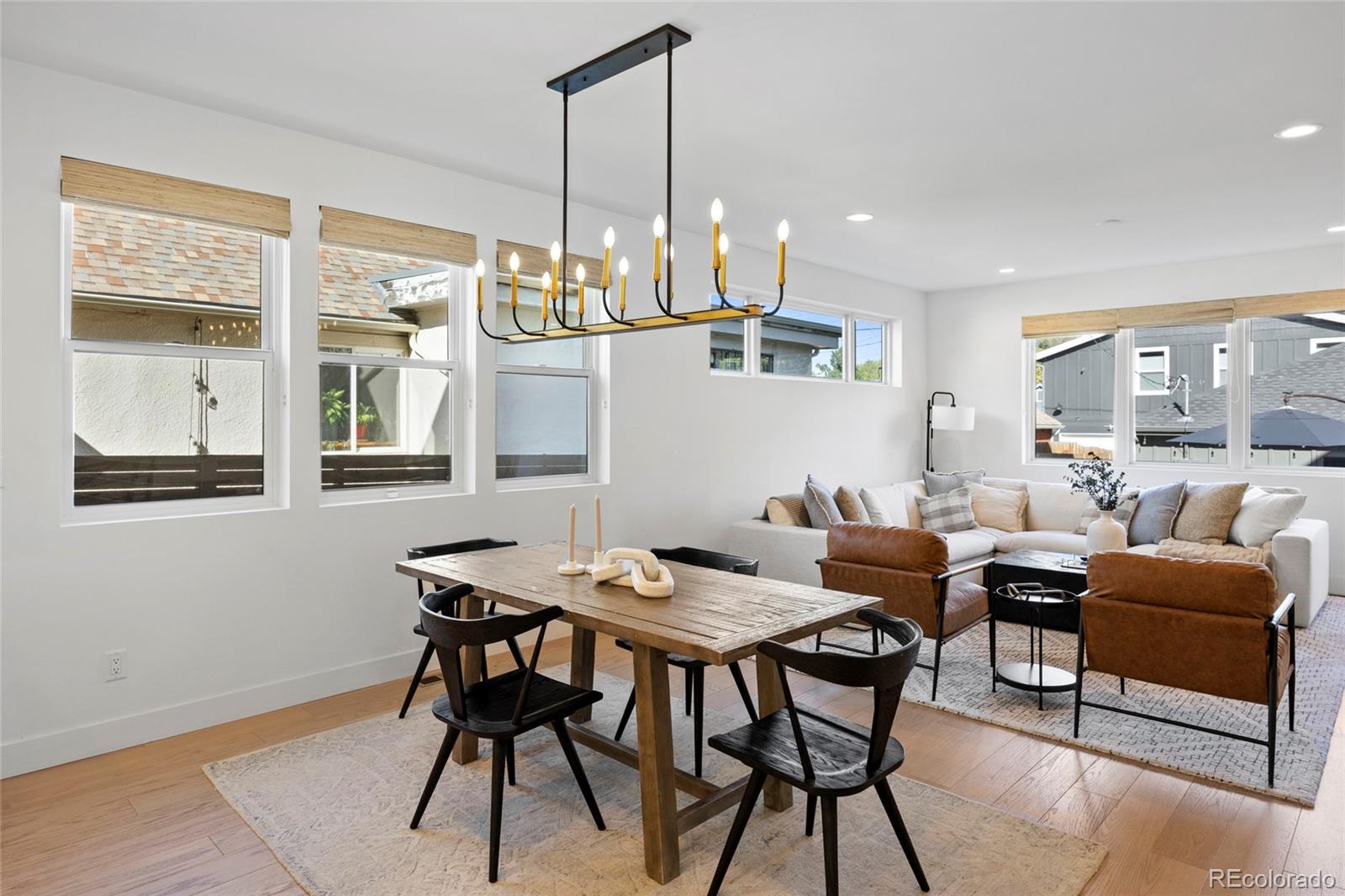 3922 Osage Street Denver, CO 80211 - Photo 16 of 44 a view of a dining room with furniture window and wooden floor