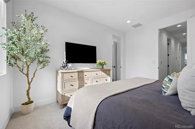 a bathroom with a double vanity sink mirror and toilet