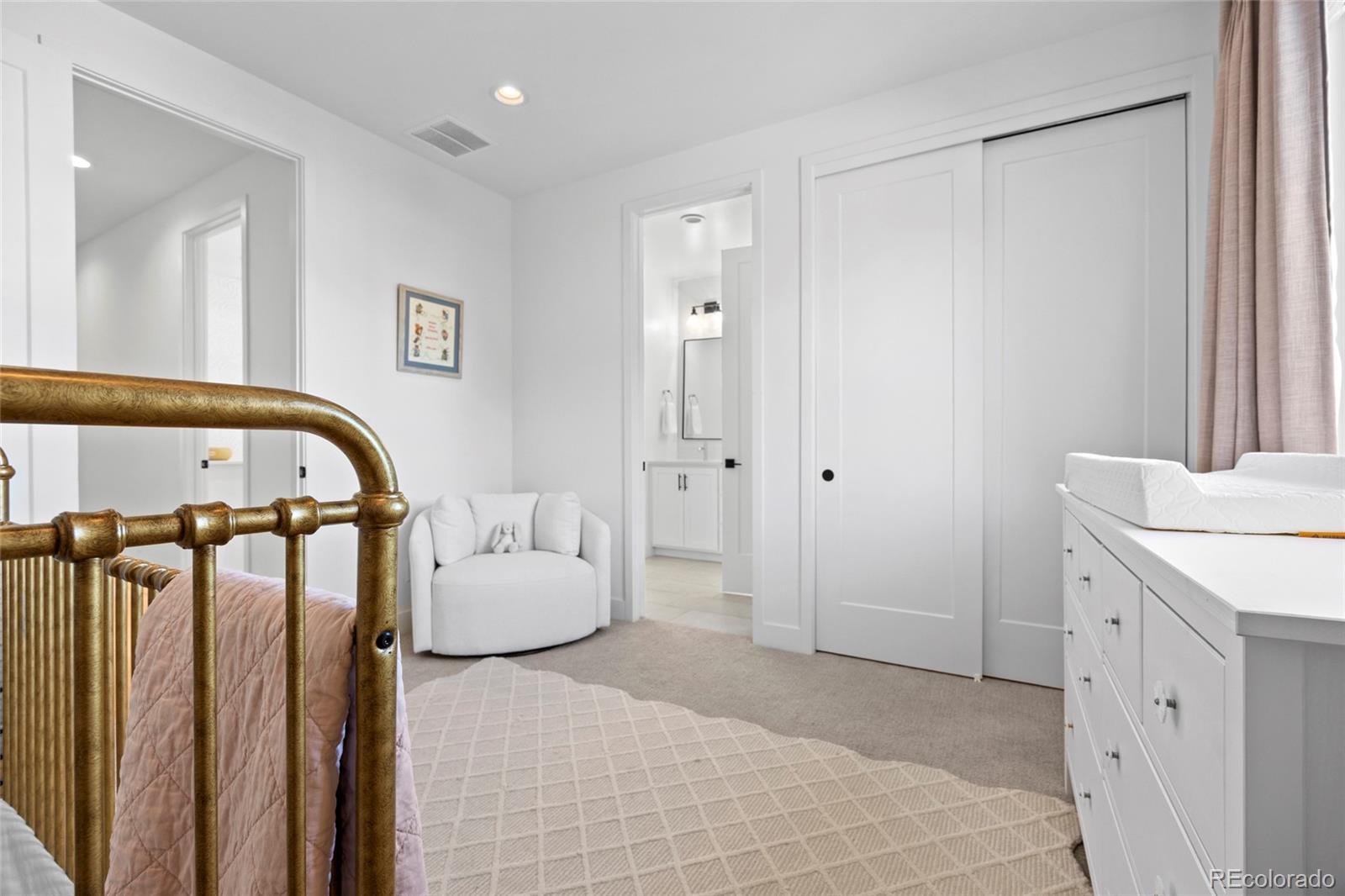 3922 Osage Street Denver, CO 80211 - Photo 25 of 44 a bedroom with a bed and a mirror