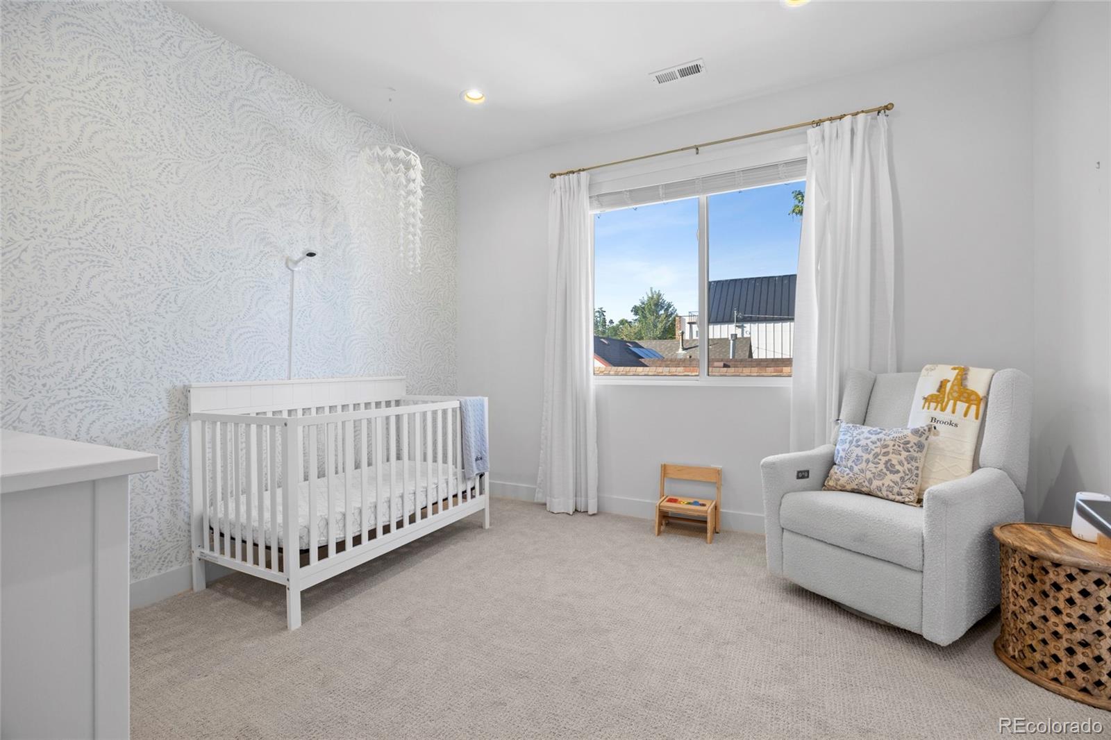 3922 Osage Street Denver, CO 80211 - Photo 27 of 44 a bedroom with furniture and a window