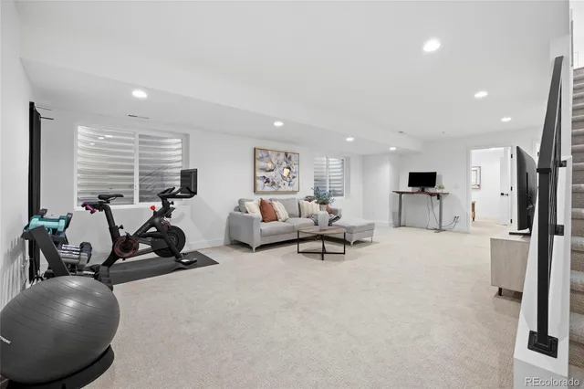 a bathroom with a double vanity sink toilet and mirror