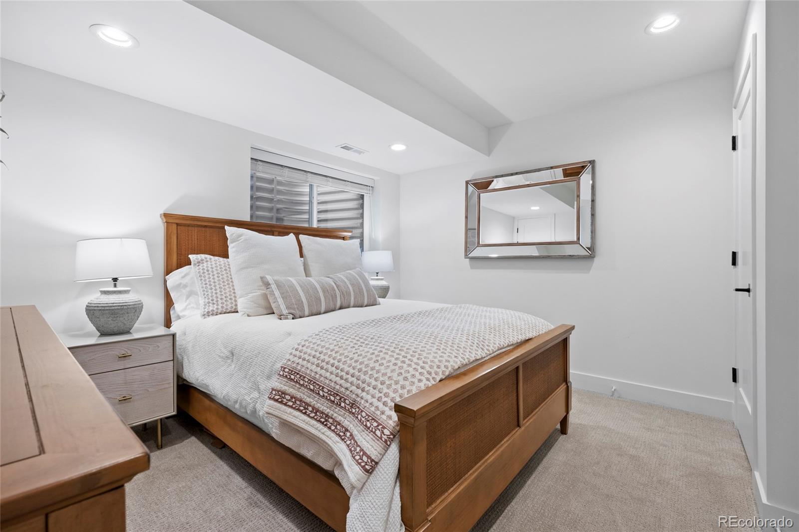 3922 Osage Street Denver, CO 80211 - Photo 32 of 44 a bed room with a bed and a couch