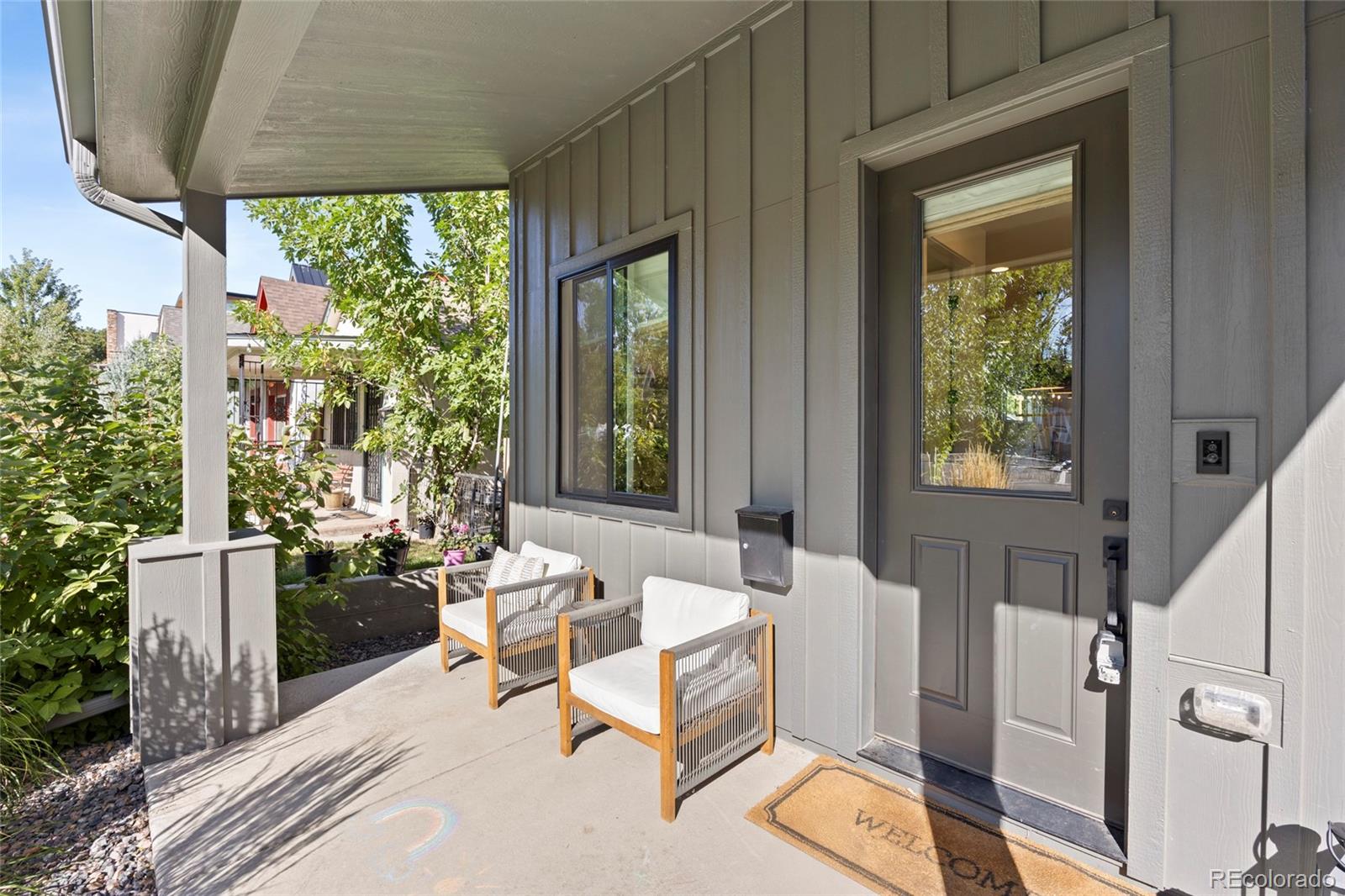 3922 Osage Street Denver, CO 80211 - Photo 5 of 44 a living room with patio furniture and a potted plant