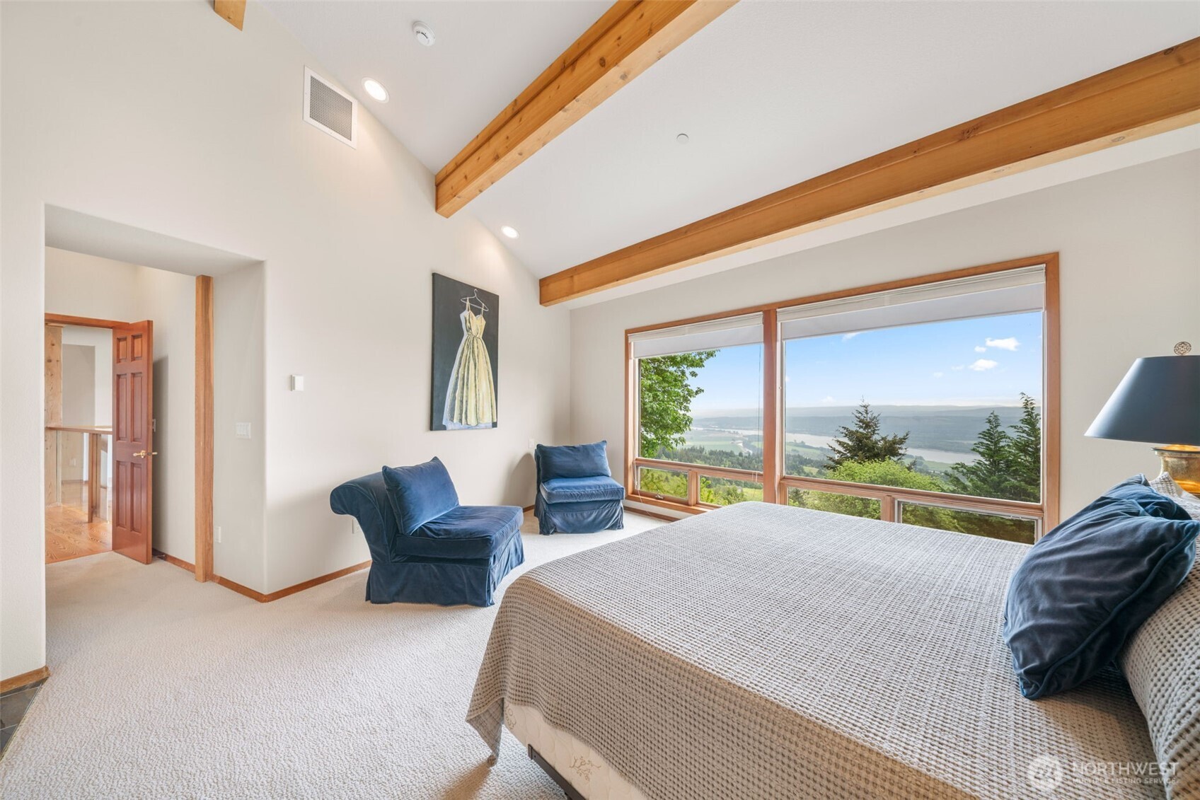 813 Varsity Road Kalama, WA 98625 - Photo 21 of 40 a large bedroom with a large bed and a large window