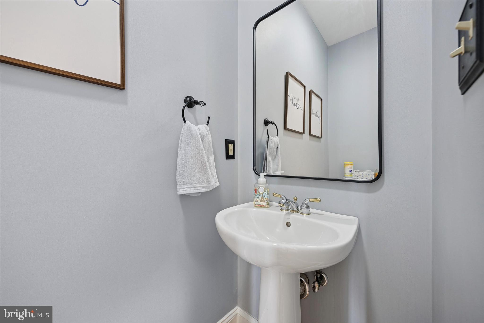 321 Lenni Road Lenni, PA 19052 - Photo 12 of 35 a bathroom with a sink and a mirror