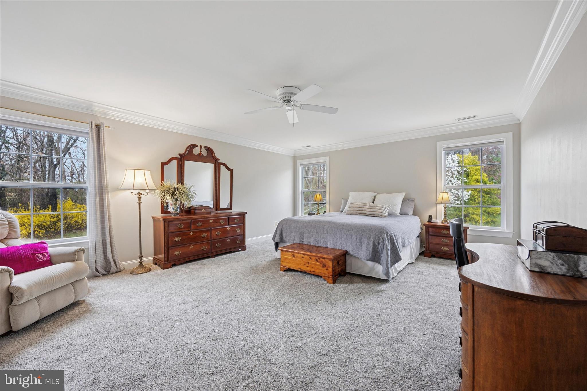 321 Lenni Road Lenni, PA 19052 - Photo 14 of 35 a spacious bedroom with a bed a couch and a window