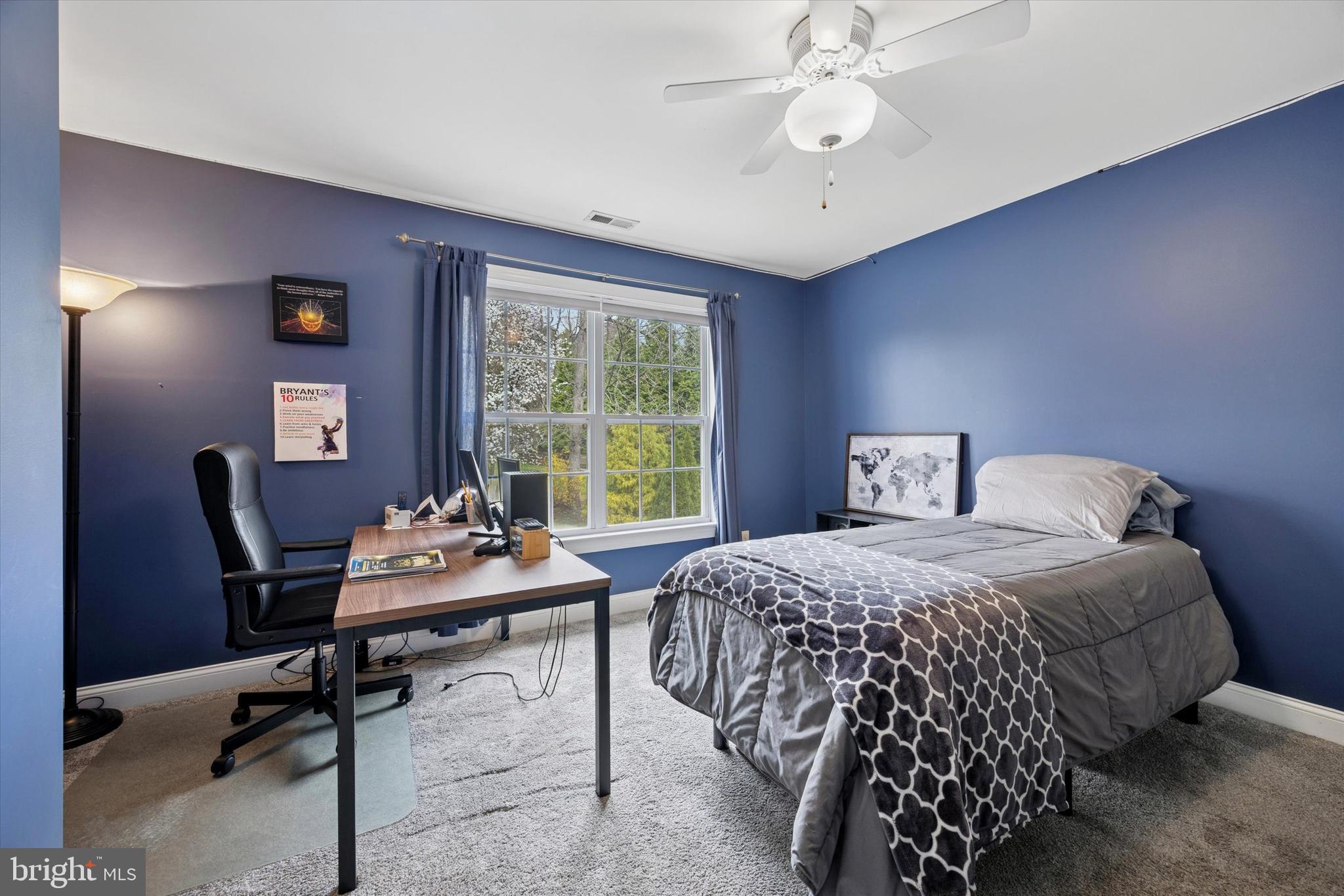 321 Lenni Road Lenni, PA 19052 - Photo 21 of 35 a bedroom with a bed table chair and a window