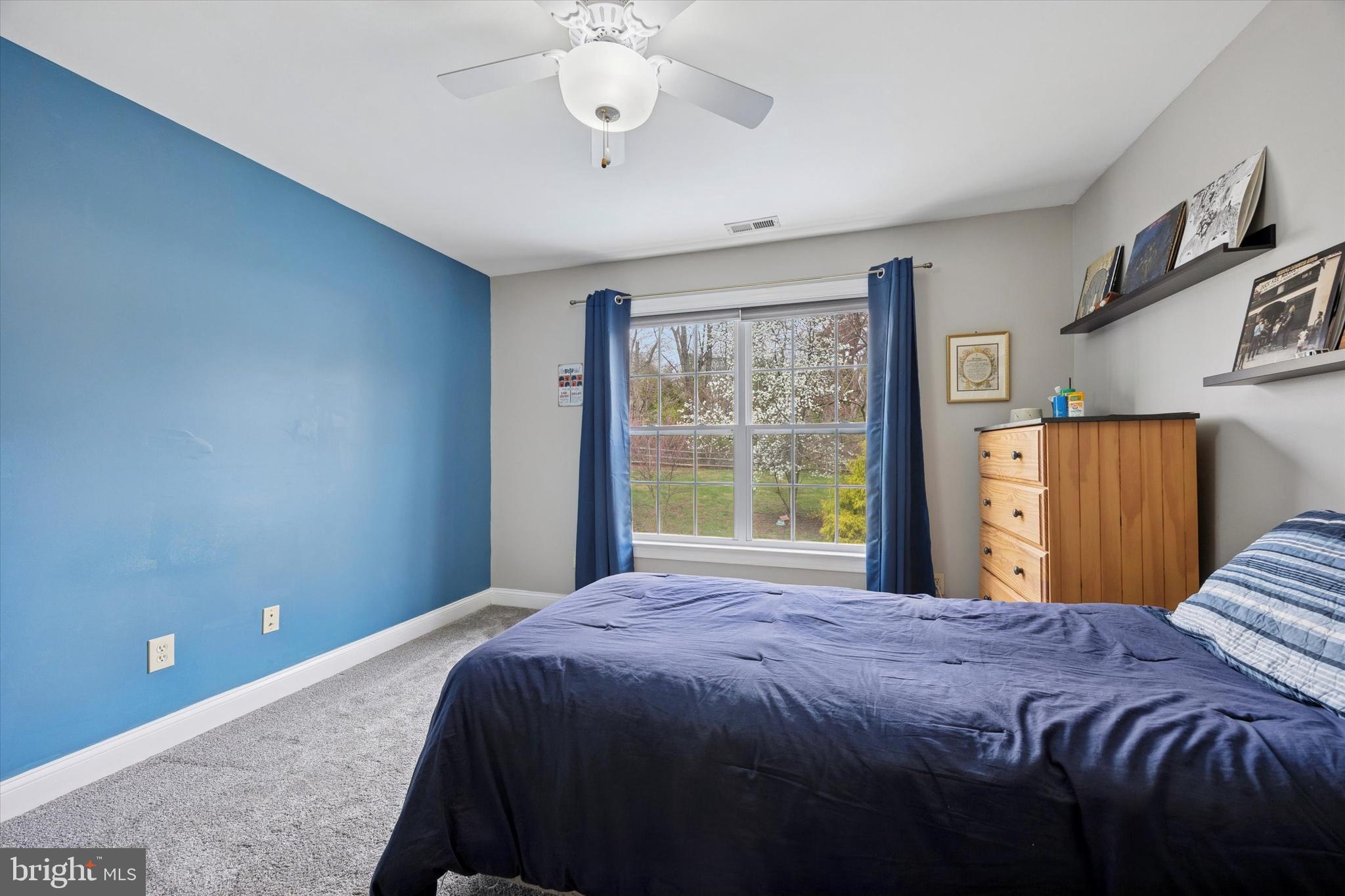 321 Lenni Road Lenni, PA 19052 - Photo 23 of 35 a bedroom with a large bed and a chandelier