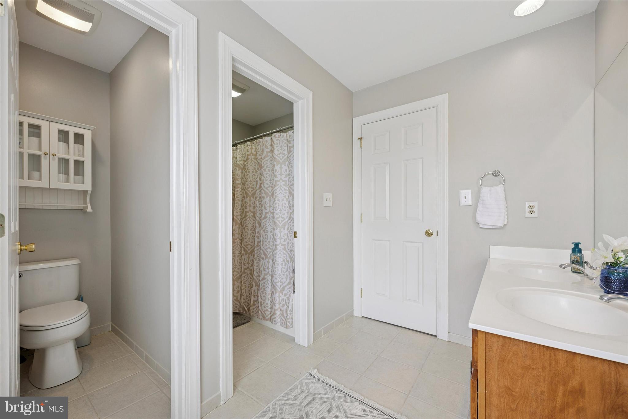321 Lenni Road Lenni, PA 19052 - Photo 25 of 35 a bathroom with a sink and a mirror