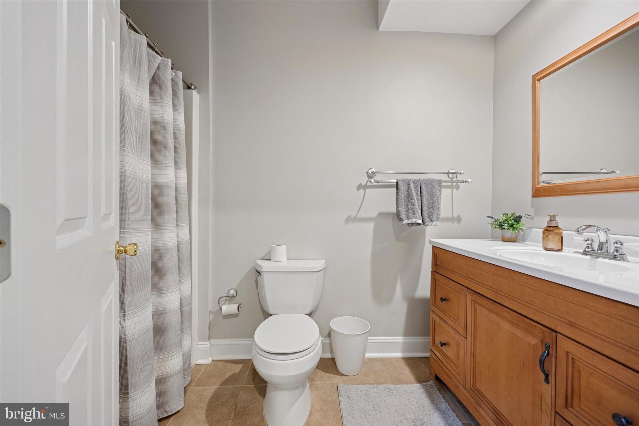 321 Lenni Road Lenni, PA 19052 - Photo 30 of 35 a bathroom with a sink a toilet and shower