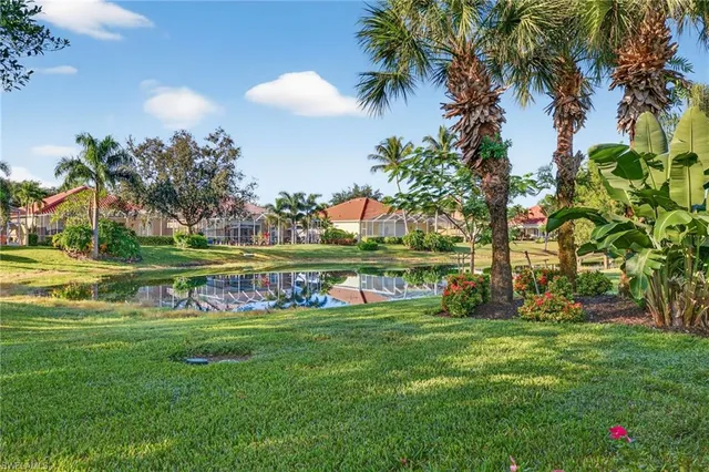 an aerial view of a house with a garden and swimming pool