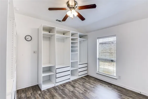 a view of room with stairs and a ceiling fan