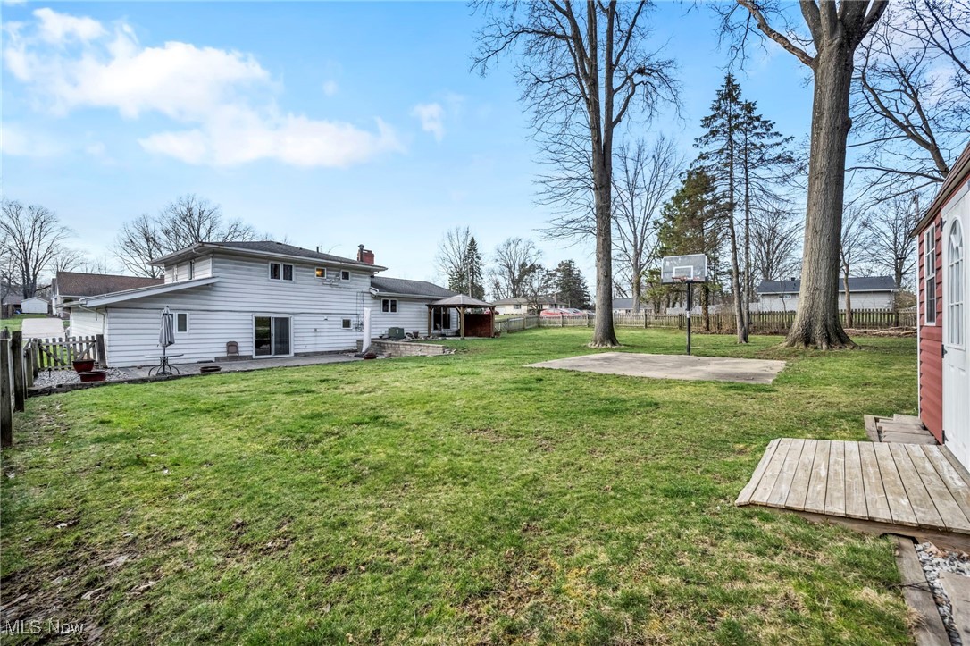 3673 Oak Road Stow, OH 44224 - Photo 16 of 20 View of yard with a fenced backyard and a patio