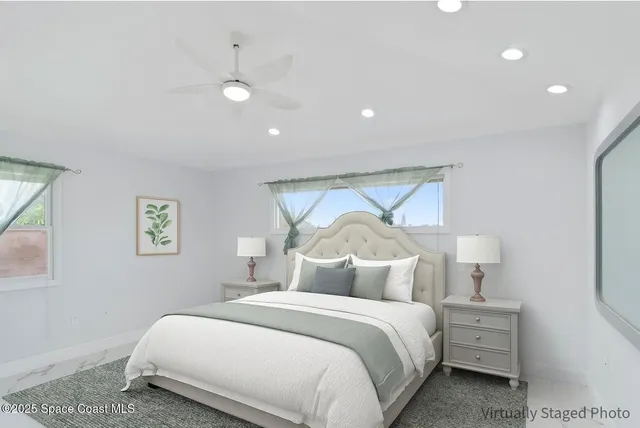 a room with furniture and a ceiling fan