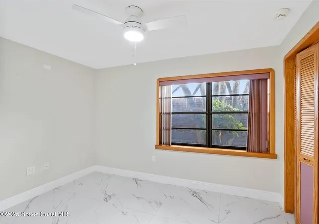 an aerial view of a house with a garden and lake view