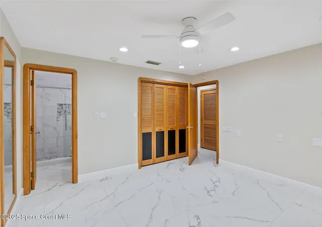 an aerial view of a house with a lake view