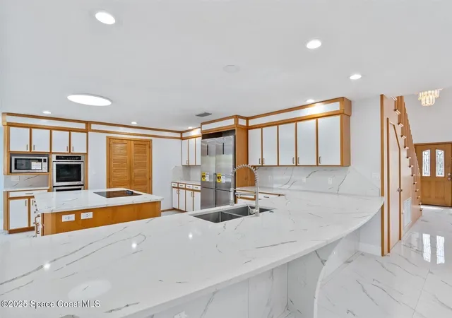 a bathroom with a shower and a glass door