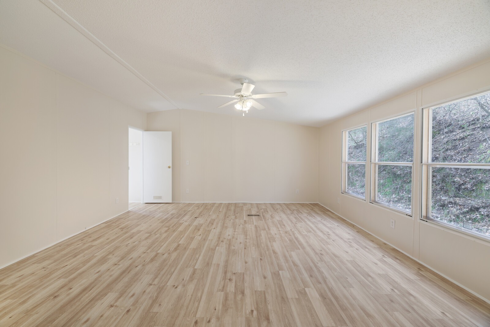 462 Pole Hill Road Goodlettsville, TN 37072 - Photo 11 of 41 an empty room with wooden floor and windows