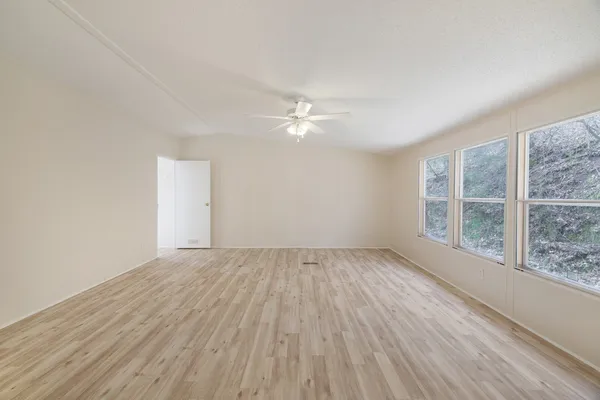 a view of wooden floor in an empty room